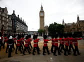 Grenadier Guards march past the Elizabeth Tower, more commonly known as Big Ben in London. (Photo by SARAH MEYSSONNIER/POOL/AFP via Getty Images)