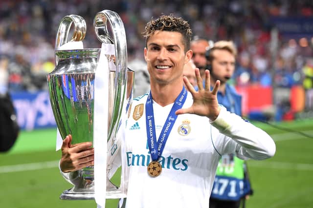 Ronaldo lifting one of his 32 trophies in May 2018