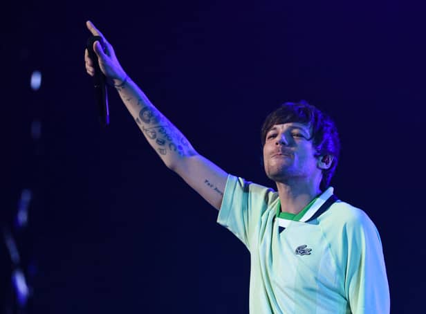 <p>Louis Tomlinson has cancelled album signings across the UK (image: AFP/Getty Images)</p>