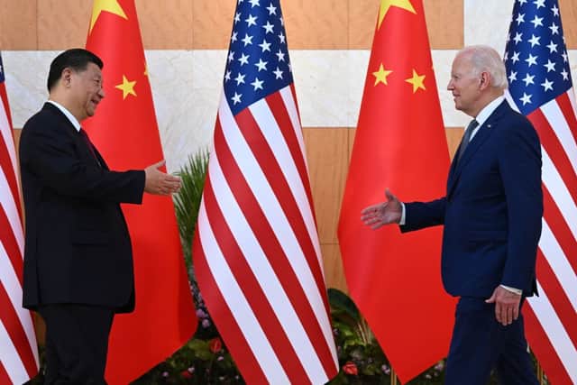 US President Joe Biden and China’s President Xi Jinping shake hands as they meet on the sidelines of the G20 Summit in Bali. Credit: Getty Images