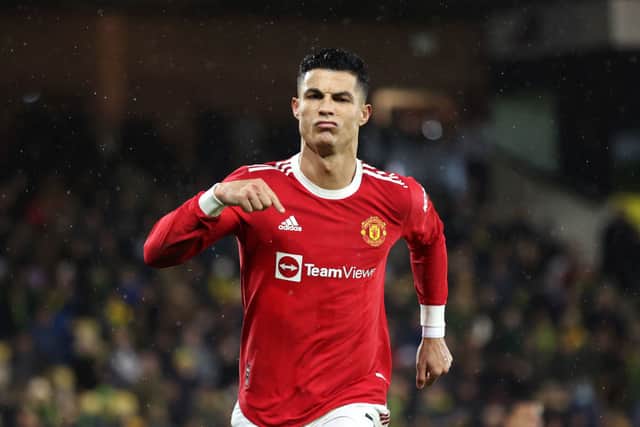 Cristiano Ronaldo of Manchester United celebrates after scoring his sides first goal from the penalty spot during the Premier League match between Norwich City and Manchester United at Carrow Road on December 11, 2021 in Norwich, England. (Photo by Alex Pantling/Getty Images)