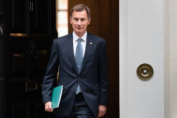 Jeremy Hunt leaves 11 Downing Street, London, for the House of Commons to deliver his autumn statement. Credit: PA
