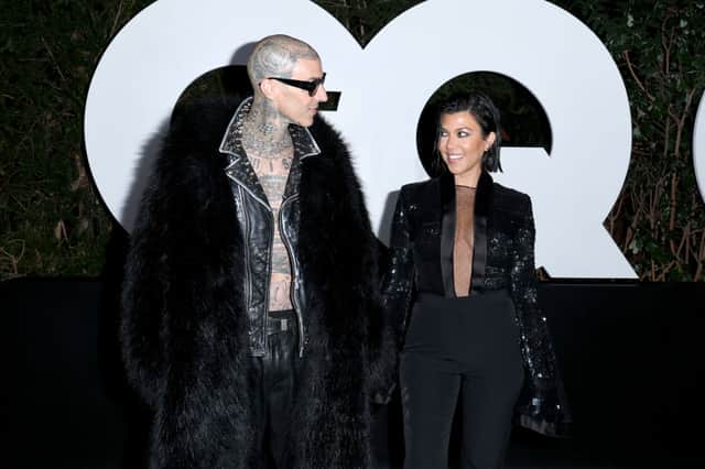 Kourtney Kardashian Barker and husband Travis know all about 'matchy matchy' dressing in 2022. (Photo by Phillip Faraone/Getty Images for GQ)