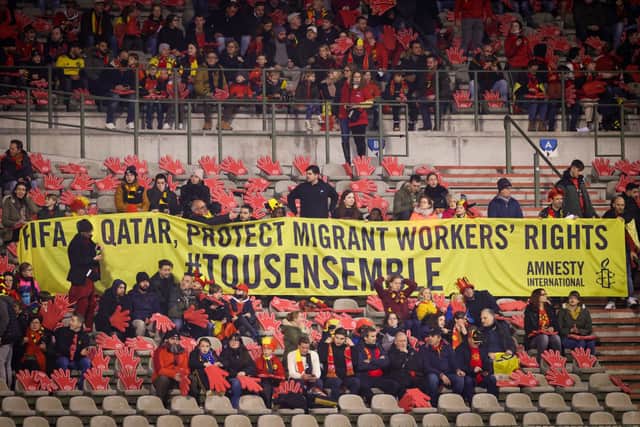 Belgium’s supporters with a banner asking for protection of migrant workers’ rights in Qatar. Credit: Getty Images