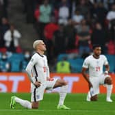 Players kneel down against racism before the UEFA EURO 2020 Group D football match between England and Scotland at Wembley Stadium in London on June 18, 2021 (Photo: JUSTIN TALLIS/POOL/AFP via Getty Images)