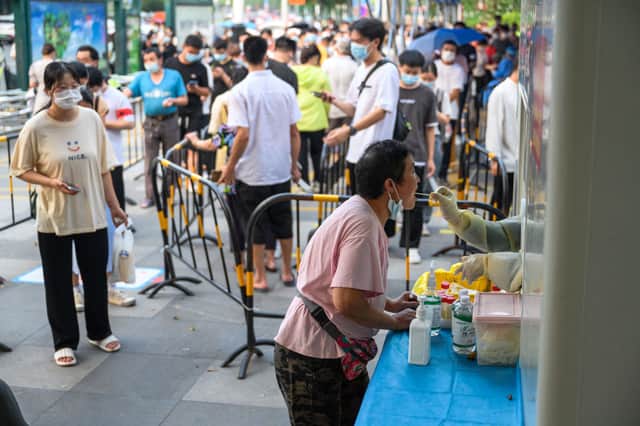 The southern Chinese city of Guangzhou has locked down its largest district as it tries to control a major outbreak of Covid  (Photo: STR/AFP via Getty Images)