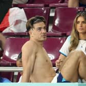 Jack Grealish celebrating with girlfriend, Sasha Attwood following England's win against Iran. (Photo by Jean Catuffe/Getty Images)