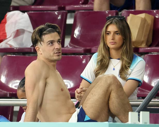 Jack Grealish celebrating with girlfriend, Sasha Attwood following England's win against Iran. (Photo by Jean Catuffe/Getty Images)