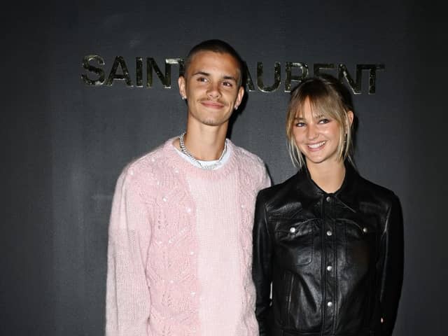 Romeo Beckham and Mia Regan attend the Saint-Laurent Womenswear Fall/Winter 2022/2023 show as part of Paris Fashion Week on March 01, 2022 in Paris, France. (Photo by Pascal Le Segretain/Getty Images)