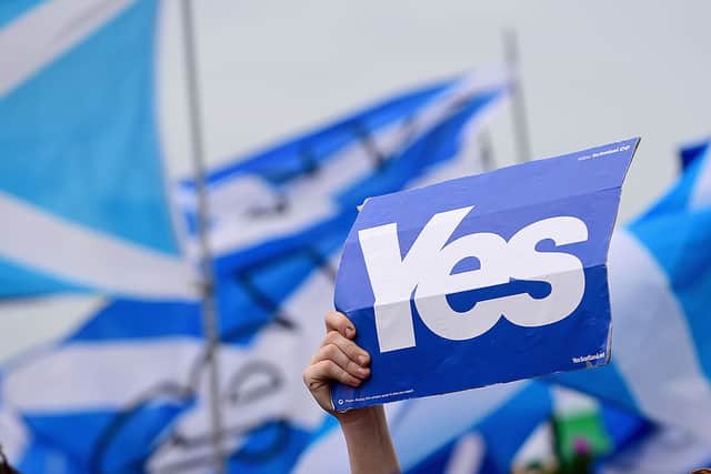 Pro independence supporters march through Glasgow on September 14, 2014 in Scotland (Photo by Jeff J Mitchell/Getty Images)