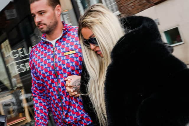Katie Price and Carl Woods attend Lewes Crown Court on May 25, 2022 in Lewes, England. British model and media personality Katie Price is in court to face harassment charges following an incident with Michelle Penticost, the fiancee of Price's ex-husband Kieran Hayler. (Photo by Tristan Fewings/Getty Images)