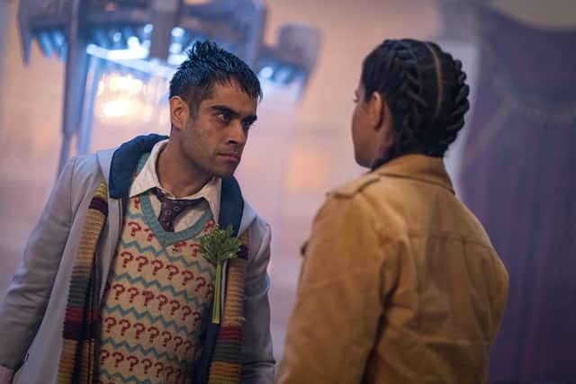 Saha Dhawan as the Master as the Doctor, wearing a scarf and question mark jumper, confronting Mandip Gill as Yaz (Credit: James Pardon/BBC Studios)