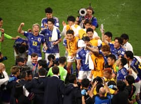Japan players celebrate the 2-1 win over Germany (Getty Images)