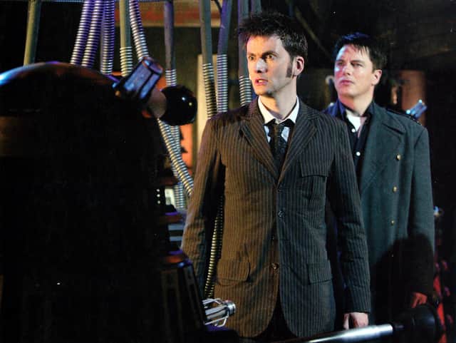 David Tennant as the Tenth Doctor with John Barrowman as Captain Jack, being menaced by a Dalek in Journey’s End (Credit: BBC Wales)