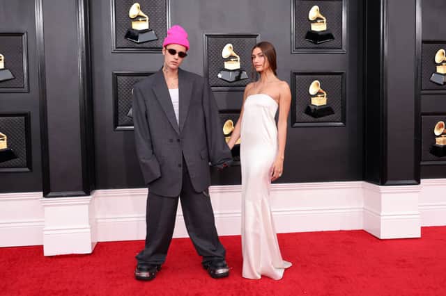 Hailey Bieber may have looked picture perfect at the Grammys, but husband Justin Bieber's oversized blazer (more than a few sizes too big) was a big fashion no no. (Photo by Amy Sussman/Getty Images)