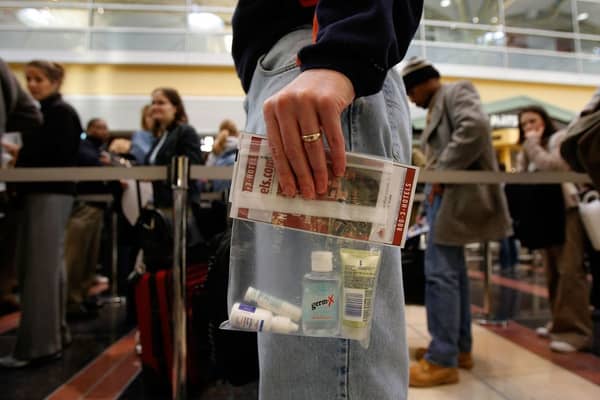 Fears of travel chaos this summer are mounting as airports across the UK delay the scrapping of the 100ml liquid rule. Picture: Getty Images