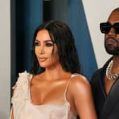 Kanye West has been accused of showing explicit photos of his ex-wife Kim Kardashian to Adidas staff.