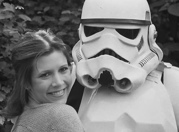 Carrie Fisher poses with a Stormtrooper in 1980 (Photo: Getty Images)