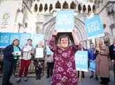 Heidi Crowter stands in front of her supporters, outside the Royal Courts of Justice in central London.