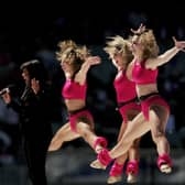 Irene Cara and dancers perform as part of the pre match entertainment at  the AFL Grand Final match between the Sydney Swans and the West Coast Eagles at the Melbourne Cricket Ground on September 30, 2006 in Melbourne, Australia.  (Photo by Mark Dadswell/Getty Images)