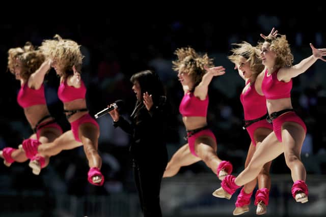 Irene Cara and dancers perform as part of the pre match entertainment at  the AFL Grand Final match between the Sydney Swans and the West Coast Eagles at the Melbourne Cricket Ground on September 30, 2006 in Melbourne, Australia.  (Photo by Mark Dadswell/Getty Images)