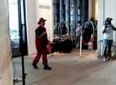 Video grab of  the moment Boy George was greeted by his classic hit Karma Chameleon as he walked into a five-star hotel after exiting I'm A Celeb.See SWNS story SWSYboygeorge.  The singer, 61, became the fourth campmate to be voted out of the ITV show on Tuesday (22/11). And he was met at the JW Marriott Resort & Spa on Australia's Gold Coast by a rendition of his Culture Club classic.Video shows well-wishers singing to George as he steps inside the plush Surfers Paradise hotel.