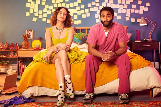 Jessica Brown Findlay as Tiffany and Anthony Welsh as Leon in The Flatshare, surrounded by post-it notes (Credit: Paramount+)