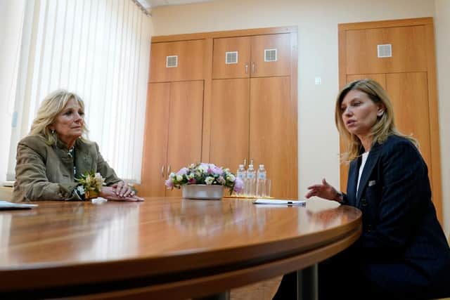 First Lady Jill Biden (L) looks at Ukrainian President wife Olena Zelenska (R), as they talk during their visit of School 6, a public school that has taken in displaced students in Uzhhorod, as part of an unannounced visit of Jill Biden to Ukraine on the sidelines of an official trip in nearby Slovakia.  (Photo by SUSAN WALSH/POOL/AFP via Getty Images)