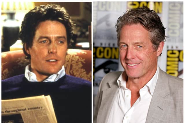 Hugh Grant as David in Love Actually in 2003; Hugh Grant at SDCC in 2022 (Credit: Universal; Daniel Knighton/Getty Images for Paramount Pictures)