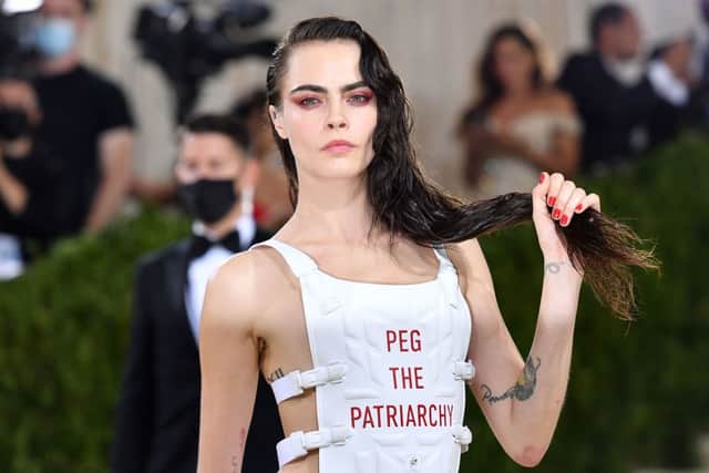 English model Cara Delevingne arrives for the 2021 Met Gala at the Metropolitan Museum of Art on September 13, 2021 in New York (Photo by ANGELA WEISS/AFP via Getty Images)