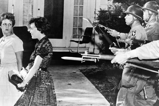 The National Guard had to step in to protect black students in Little Rock, Arkansas in 1957 amid racist protests (image: AFP/Getty Images)