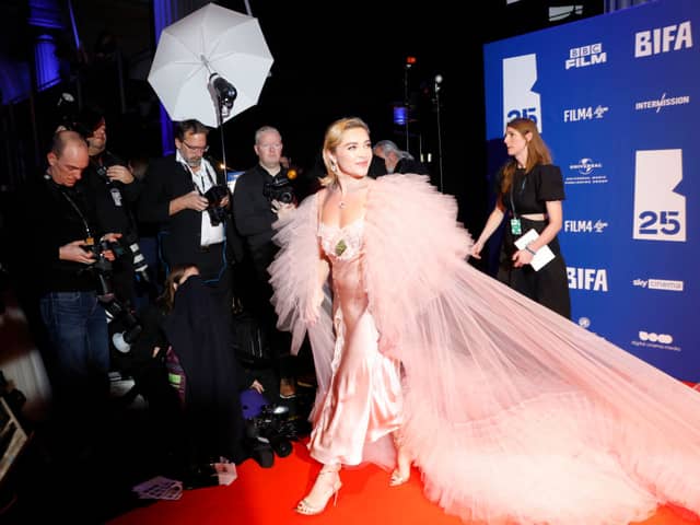 Florence Pugh ensured that all photographers were taking photos of her in her stunning slip dress.  (Photo by Tristan Fewings/Getty Images)