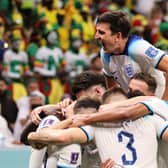 Harry Maguire of England celebrates with team mates after his captain Harry Kane of England scores their teams second goal during the FIFA World Cup Qatar 