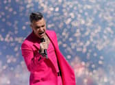 Robbie Williams is making history by becoming the first music act to play a live gig at Sandringham Estate. (Credit: Getty Images)