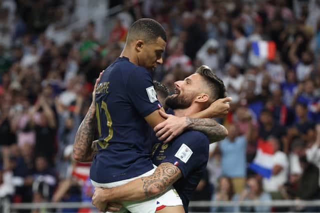 Olivier Giroud celebrates with Mbappe after scoring France’s first goal against Poland
