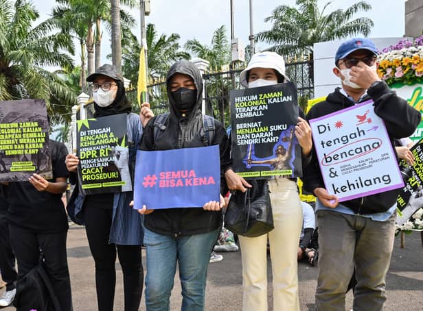 <p>Protesters in Jakarta campaign against the new criminal code which will outlaw sex before marriage and unmarried couples cohabiting. (Credit: Getty Images)</p>