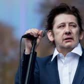 Shane MacGowan of The Pogues on stage in 2014 (Photo: Tristan Fewings/Getty Images)
