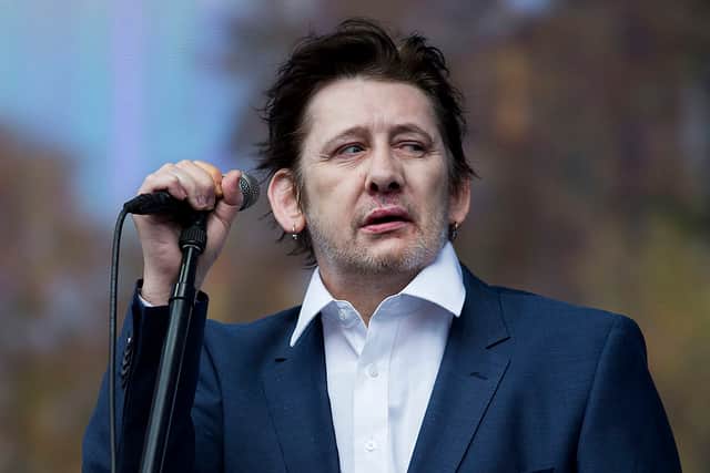 Shane MacGowan of The Pogues on stage in 2014 (Photo: Tristan Fewings/Getty Images)