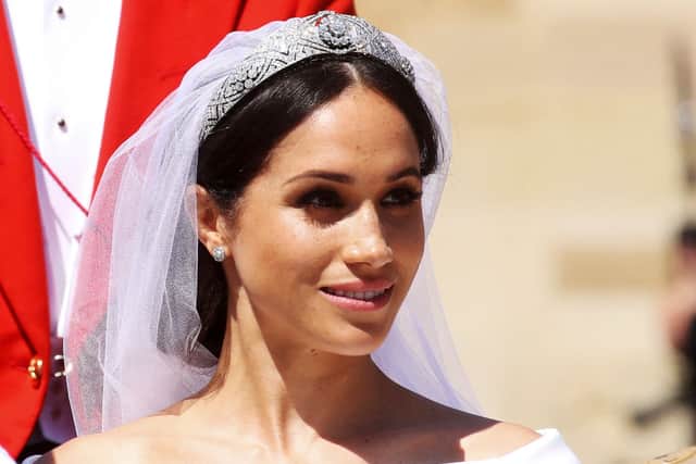Meghan Markle's white dress was reminiscent in style and colour to her wedding dress. (Photo by CHRIS JACKSON/AFP via Getty Images)