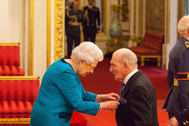 Squadron Leader George Leonard 'Johnny' Johnson from Bristol as he was made an MBE (Member of the Order of the British Empire) by Queen Elizabeth II at Buckingham Palace. Mr Johnson, the last surviving Dambuster, has died at the age of 101. He was part of Royal Air Force 617 Squadron, which conducted a night of raids on German dams in 1943 in an effort to disable Hitler's industrial heartland. Issue date: Thursday December 8, 2022.