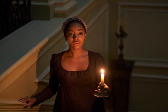 Karla Simone-Spence as Frannie Langton, holding a candle (Credit: ITVX/Drama Republic)
