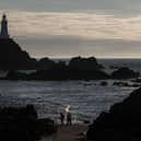 The sun sets over Corbiere Lighthouse near St Helier, Jersey (Photo: Matt Cardy/Getty Images)