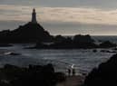 The sun sets over Corbiere Lighthouse near St Helier, Jersey (Photo: Matt Cardy/Getty Images)