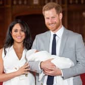 Prince Harry and Meghan Markle with their son Archie Harrison Mountbatten-Windsor, in St George’s Hall at Windsor Castle (Photo: AFP via Getty Images)