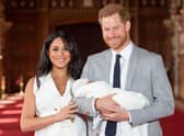 Prince Harry and Meghan Markle with their son Archie Harrison Mountbatten-Windsor, in St George’s Hall at Windsor Castle (Photo: AFP via Getty Images)