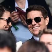 Tom Cruise and Hayley Atwell share a laugh in the Royal box at Wimbledon in 2021 (Photo: AFP via Getty Images)
