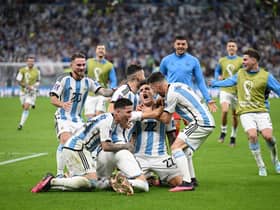  Argentina players celebrate after their win in the penalty shootout during the FIFA World Cup Qatar 2022 quarter final  (Photo by Matthias Hangst/Getty Images)