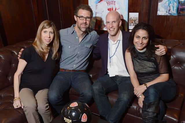 Grant Wahl and his wife Céline Gounder (L) with two others at a world cup event in 2014