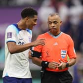Jude Bellingham of England speaks to Referee Wilton Pereira Sampaio during the FIFA World Cup Qatar 2022 quarter final match between England and France at Al Bayt Stadium on December 10, 2022 in Al Khor, Qatar. (Photo by Richard Heathcote/Getty Images)