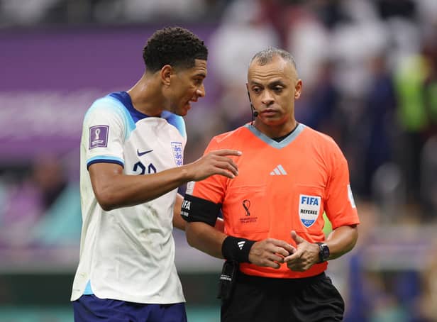 Jude Bellingham of England speaks to Referee Wilton Pereira Sampaio during the FIFA World Cup Qatar 2022 quarter final match between England and France at Al Bayt Stadium on December 10, 2022 in Al Khor, Qatar. (Photo by Richard Heathcote/Getty Images)